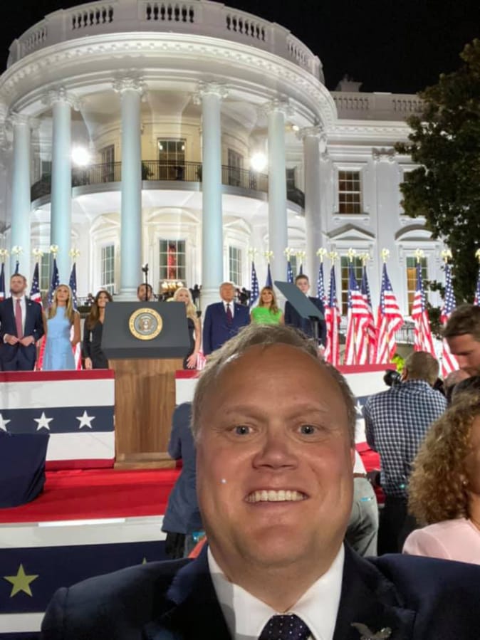 Joel Mattila, a delegate from Clark County, poses in front of the White House on the closing night of the Republican National Convention in Washington, D.C.