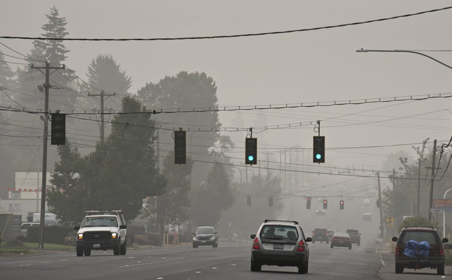 Motorists traveling on Highway 99 navigate thick wildfire smoke as it continues to choke the region.