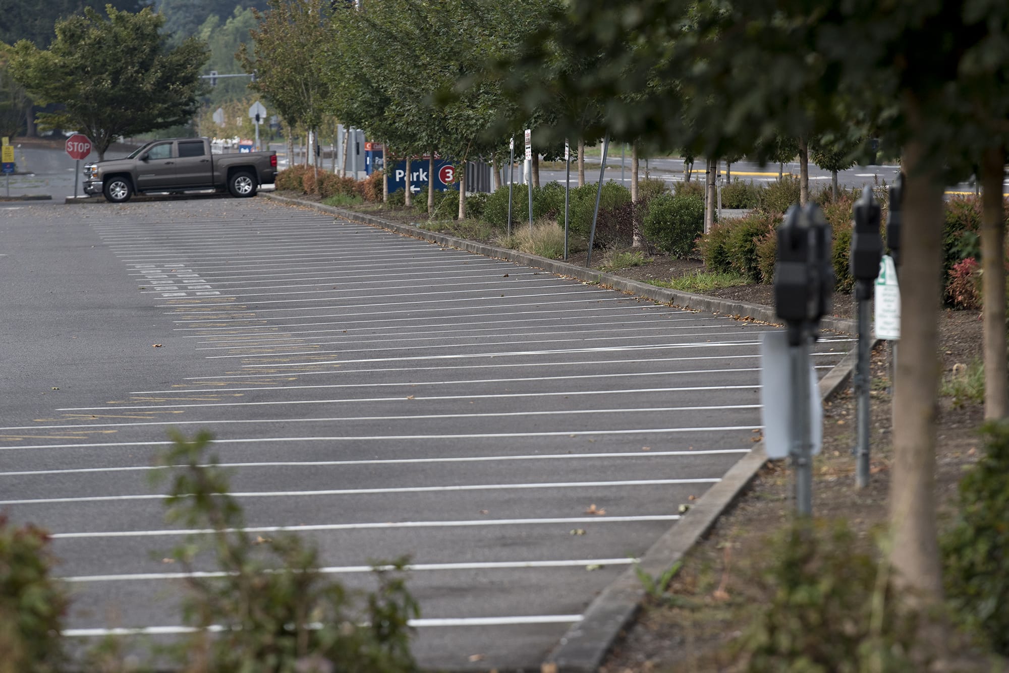 A parking lot at Clark College is nearly empty of cars as students and staff hold classes remotely on Monday morning.