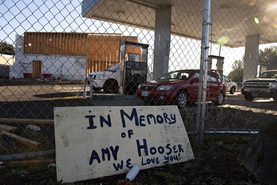A sign honors the memory of Amy Hooser at the location of the former Sifton Market. Hooser was working an early morning shift at Sifton Market when she was killed in 2017 by Mitchell Heng, who also set the building on fire.