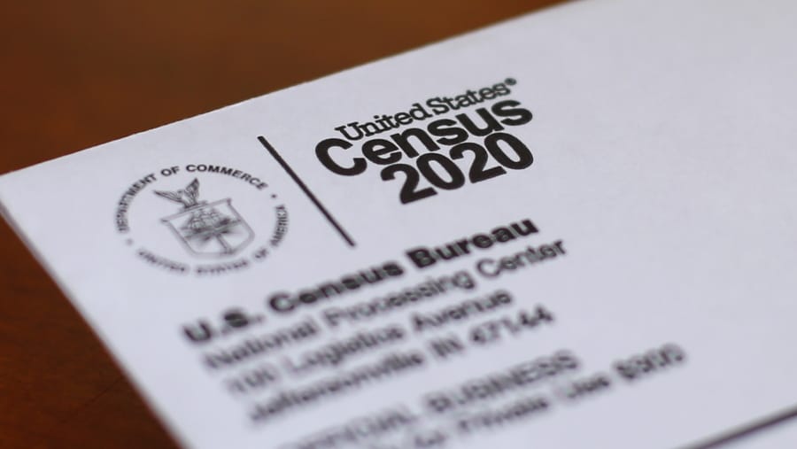 FILE - In this Sunday, April 5, 2020 file photo, An envelope containing a 2020 census letter mailed to a U.S. resident is shown in Detroit. A top lawmaker says the Trump administration is seeking to delay deadlines for the 2020 census because of the coronavirus outbreak. U.S. Rep. Carolyn Maloney said Monday, April 13, 2020 that administration officials also were asking that the timetable for releasing apportionment and redistricting data used to draw congressional and legislative districts be pushed back.