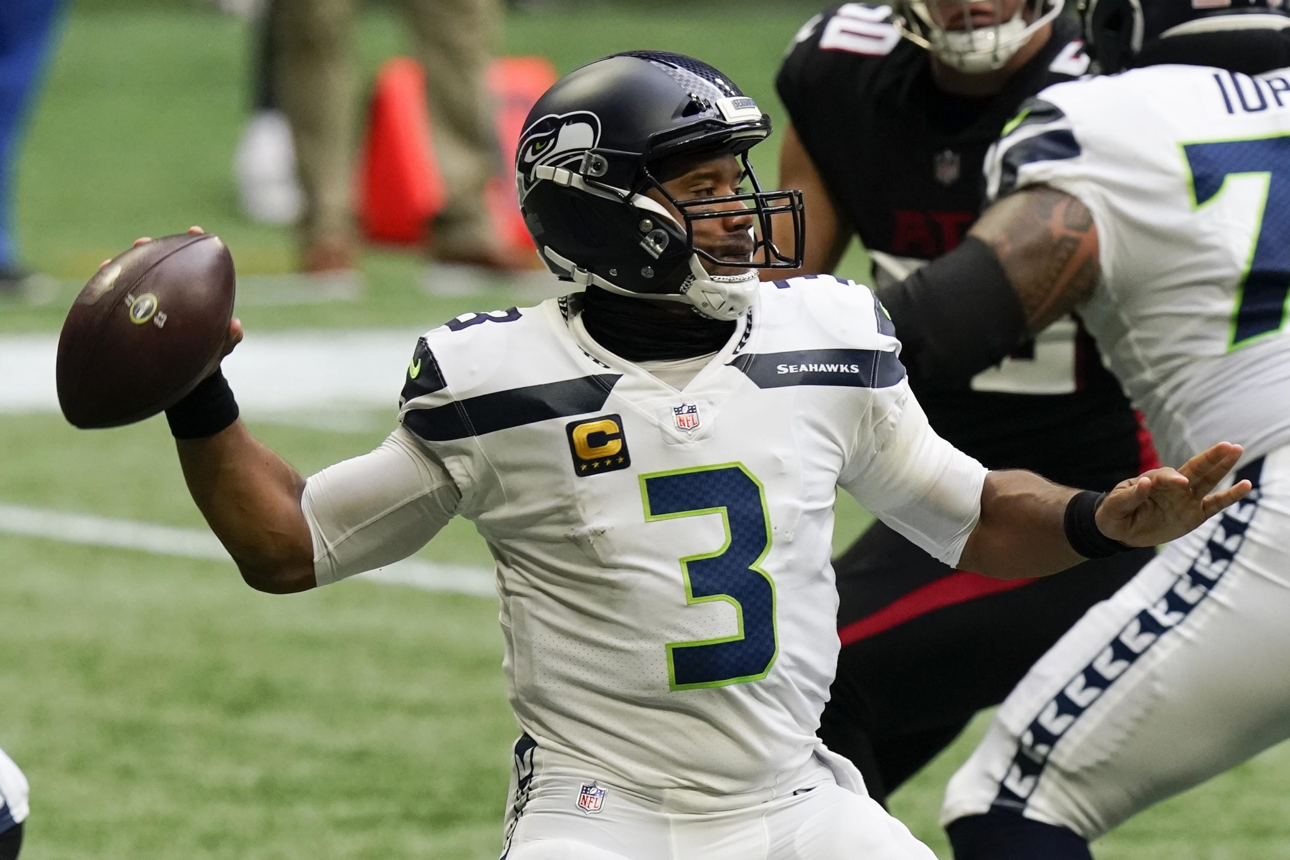 Seattle Seahawks quarterback Russell Wilson (3) works in the p[ocket against the Atlanta Falcons during the first half of an NFL football game, Sunday, Sept. 13, 2020, in Atlanta.
