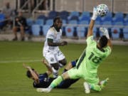 Portland Timbers forward Yimmi Chara (23), center, scores a goal against San Jose Earthquakes defender Paul Marie (33) and San Jose Earthquakes goalkeeper JT Marcinkowski (18), right, during the first half of an MLS soccer match Wednesday, Sept. 16, 2020, in San Jose, Calif.