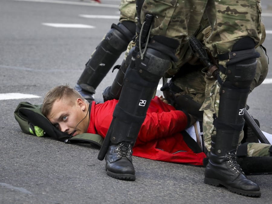 Riot police officers detain a protester during a Belarusian opposition supporters&#039; rally protesting the official presidential election results in Minsk, Belarus, Sunday, Sept. 13, 2020. Protests calling for the Belarusian president&#039;s resignation have broken out daily since the Aug. 9 presidential election that officials say handed him a sixth term in office.
