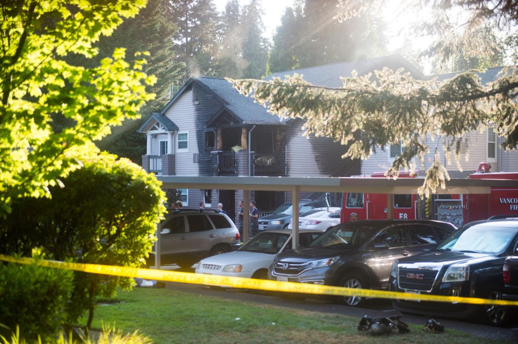 Firefighters attend to the scene of a fire at the Autumn Chase Apartments in Vancouver on Wednesday evening, July 29, 2020. Four people were injured in the fire.