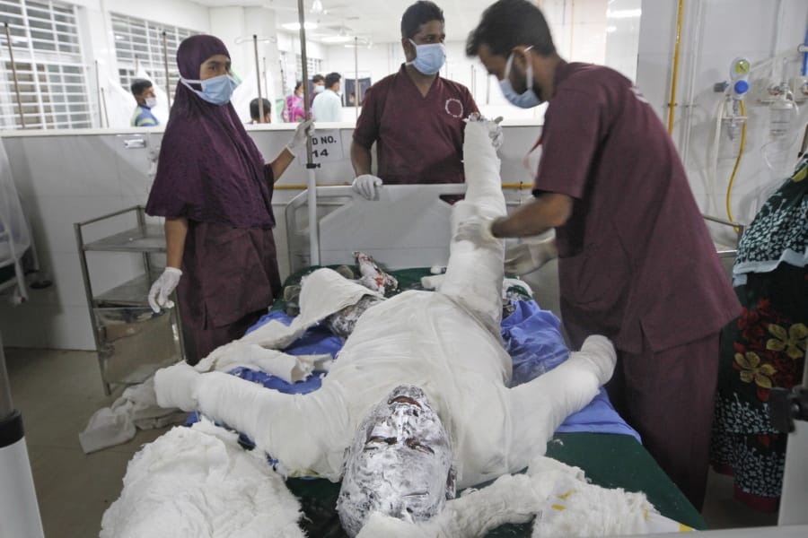 Doctors treat a burn Muslim worshipper in a hospital in Dhaka, Bangladesh, Saturday, Sept. 5, 2020. Dozens of Muslim worshipers suffered burn injuries critically during evening prayers after explosions of a gas pipeline installed underground near a mosque outside Bangladesh capital, officials said Saturday.