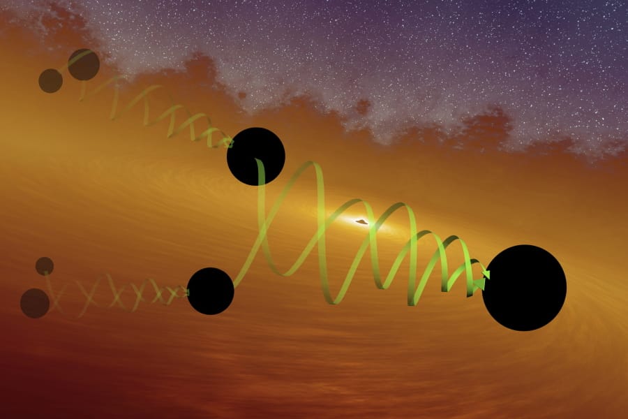 This illustration provided by LIGO/Caltech depicts two black holes of about 66 and 85 solar masses spiraling into each other to form the GW190521 black hole. Gravitational waves from the merger were detected by the LIGO and Virgo observatories in May 2019. (LIGO/Caltech/MIT/R.
