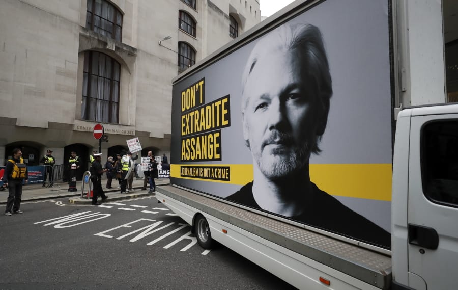 A van with a protest poster passes the Central Criminal Court Old Bailey in London, Monday, Sept. 7, 2020. Lawyers for WikiLeaks founder Julian Assange and the U.S. government were squaring off in a London court on Monday at a high-stakes extradition case delayed by the coronavirus pandemic. American prosecutors have indicted the 49-year-old Australian on 18 espionage and computer misuse charges over Wikileaks&#039; publication of secret U.S. military documents a decade ago. The charges carry a maximum sentence of 175 years in prison.