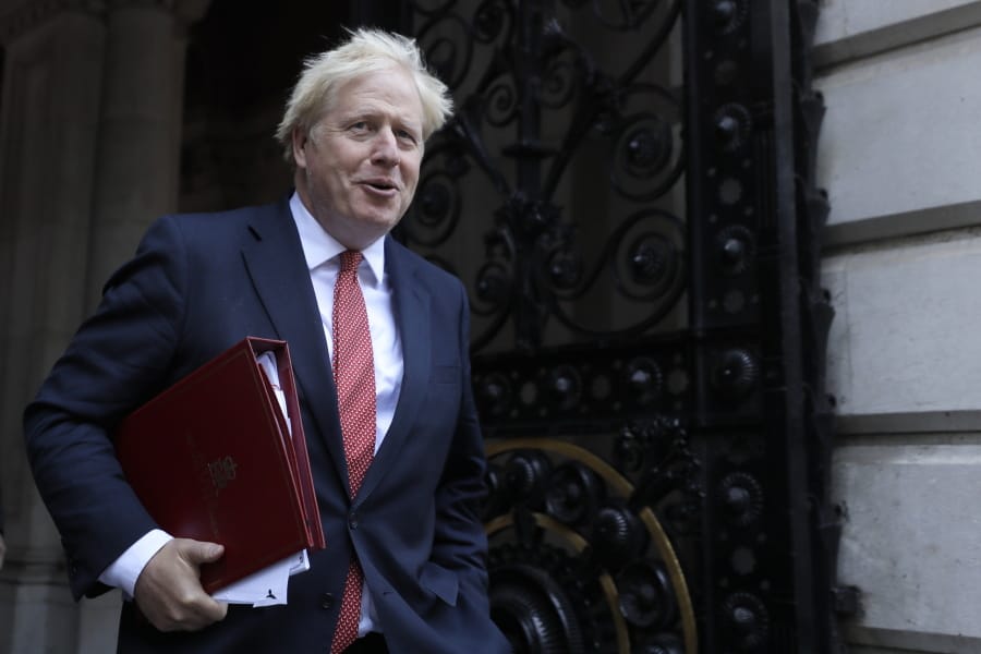 Britain&#039;s Prime Minister Boris Johnson returns to Downing Street after attending a cabinet meeting in London, Tuesday, Sept. 1, 2020. Britain&#039;s Parliament resumes Tuesday following the summer break.