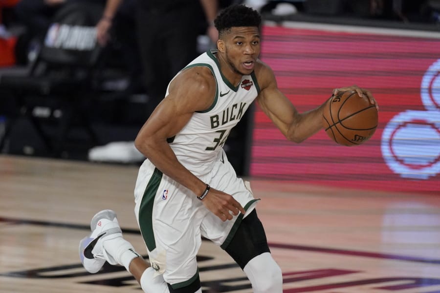 Milwaukee Bucks&#039; Giannis Antetokounmpo (34) in the second half of an NBA conference semifinal playoff basketball game against the Miami Heat Friday, Sept. 4, 2020, in Lake Buena Vista, Fla. (AP Photo/Mark J.