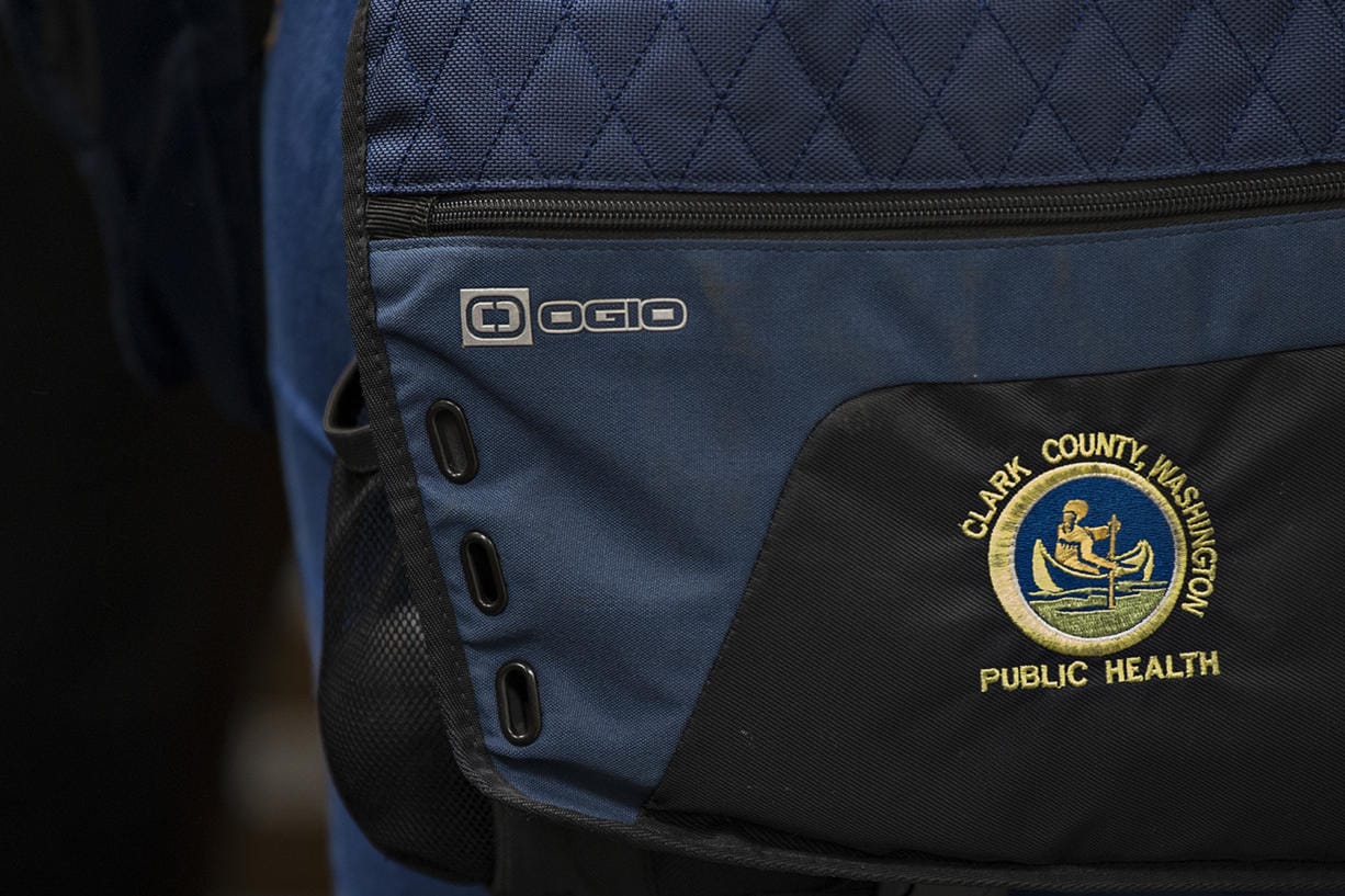A patch is seen on the bag of Clark County Public Health Environmental Health Specialist Maggie Yaddof in January. Clark County is receiving more CARES Act funding to help cover things such as salaries for Public Health employees.