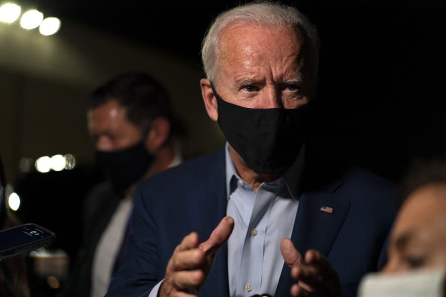 Democratic presidential candidate former Vice President Joe Biden speaks to media as he arrives at New Castle Airport, in New Castle, Del., Wednesday, Sept. 23, 2020, as he returns Charlotte, N.C.