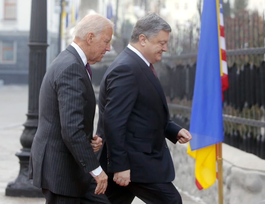 FILE - In this Jan. 16, 2017, file photo Vice President Joe Biden, left, and Ukrainian President Petro Poroshenko go for talks during Biden&#039;s visit in Kiev, Ukraine. The leaked recordings of apparent conversations between Joe Biden and Ukraine&#039;s then-president largely confirm Biden&#039;s account of his dealings in Ukraine. The choppy audio, disclosed by a Ukrainian lawmaker whom U.S. officials described Thursday, Sept. 10, 2020, as an &quot;active Russian agent&quot; who has sought to spread online misinformation about Biden.