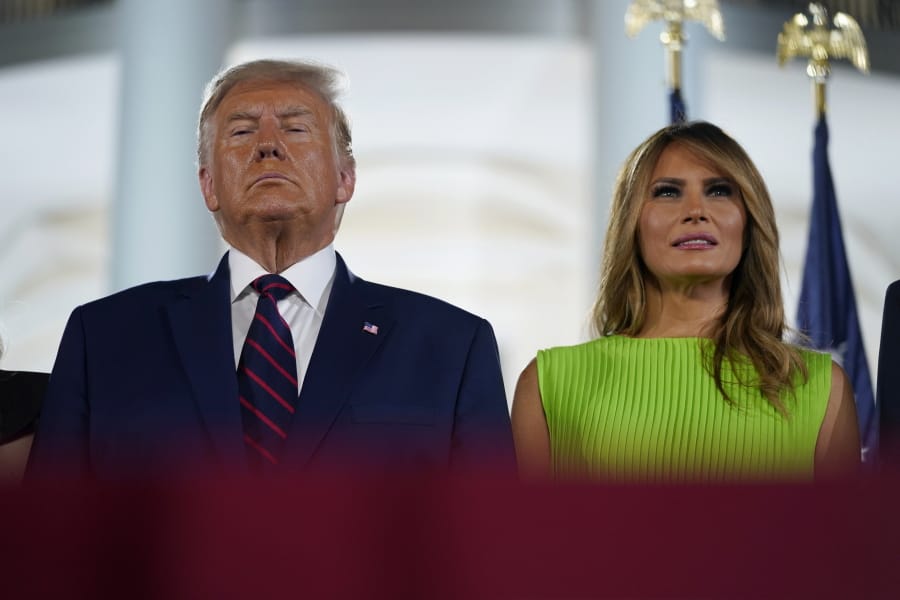President Donald Trump and first lady Melania Trump stand on stage on the South Lawn of the White House on the fourth day of the Republican National Convention, Thursday, Aug. 27, 2020, in Washington.