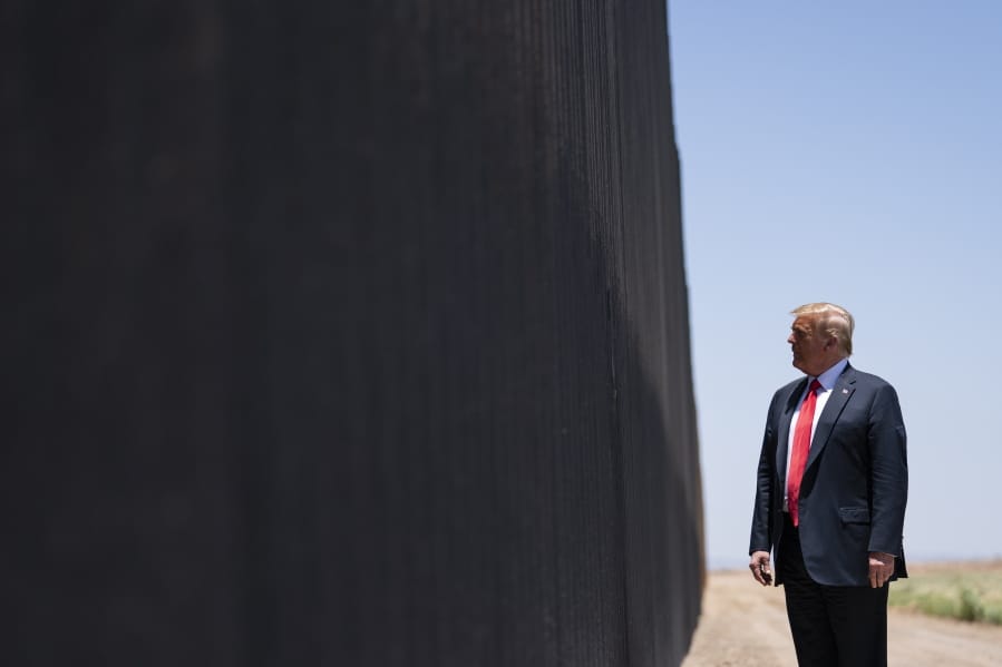 FILE - In this June 23, 2020, file photo, President Donald Trump tours a section of the border wall in San Luis, Ariz.