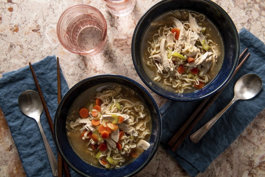 This image shows a recipe for chicken ramen noodle soup. More people are cooking at home these days, and when they do eat restaurant food, they&#039;re often looking for comfort food, experts say. Other trends include simpler recipes, recipes with fewer ingredients, one-pot meals, sheet-pan meals, finger food and pantry-ingredient recipes, all up significantly year over year. (Cheyenne M. Cohen/Katie Workman via AP) (Cheyenne M.