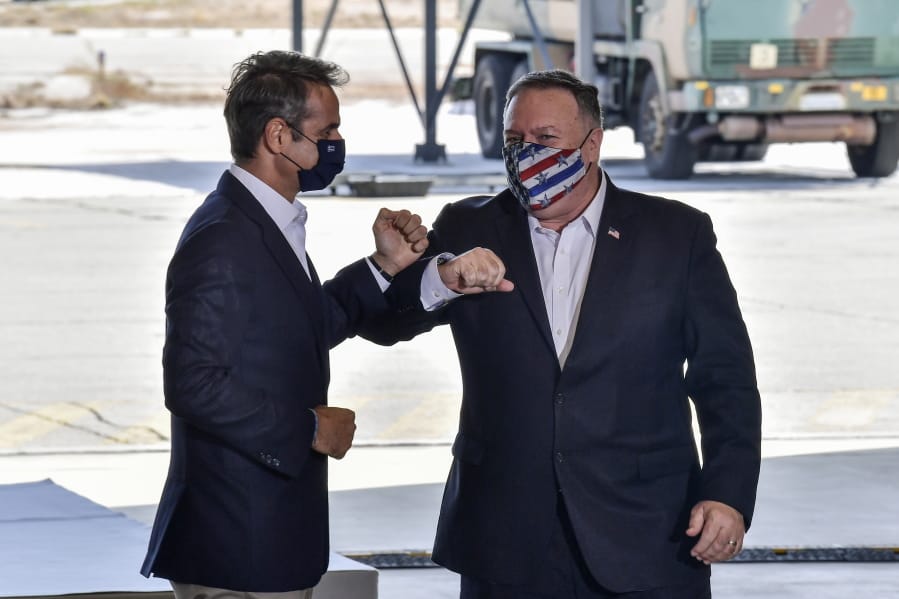 US Secretary of State Mike Pompeo, right, and Greek Prime Minister Kyriakos Mitsotakis pose during their visit at the Naval Support Activity base at Souda, on the Greek island of Crete, Tuesday, Sept. 29, 2020. Pompeo visited a U.S. naval base at Souda Bay on the southern Greek island of Crete Tuesday, ahead of a meeting with Greece&#039;s prime minister on the second day of his trip to the country.
