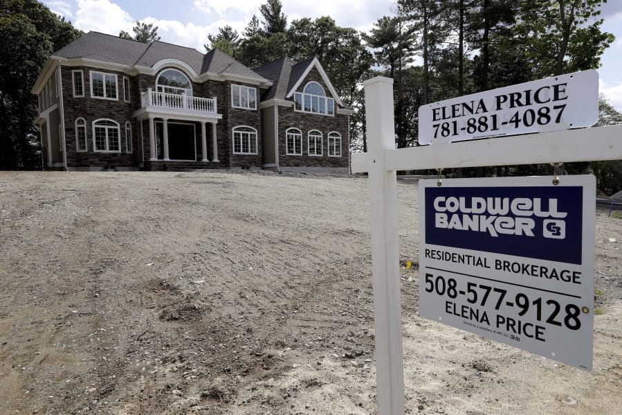 FILE - In this Sept. 3, 2019 file photo a sign rests in front of a newly constructed home, in Westwood, Mass. U.S. home prices rose in April for the eighth straight month, even as sales have stumbled, a sign the coronavirus outbreak has had little impact on real estate values. The S&amp;P CoreLogic Case-Shiller 20-city home price index climbed 4% in April, the largest gain since December 2018, up from 3.9% in March.