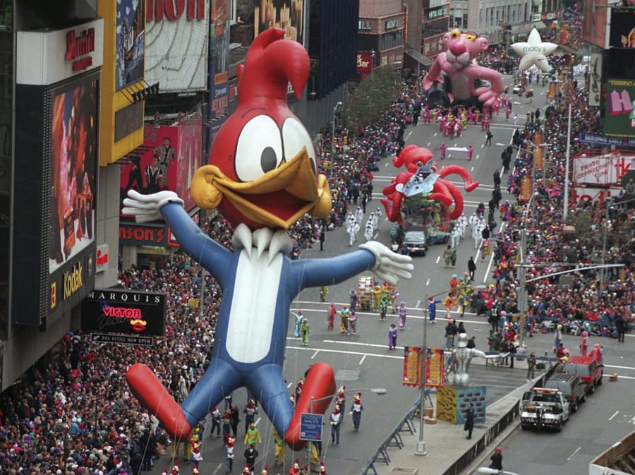 FILE - In  this Nov. 23, 1995 file photo Woody Woodpecker leads a line of other balloons and floats into New York&#039;s Times Square during the 69th annual Macy&#039;s Thanksgiving Day parade. A Macy&#039;s Thanksgiving parade reimagined for the coronavirus pandemic will feature floats, performers and giant balloons parading along a one-block stretch of 34th Street in front of the retailer&#039;s flagship Manhattan store, Macy&#039;s officials announced Monday, Sept. 14, 2020.
