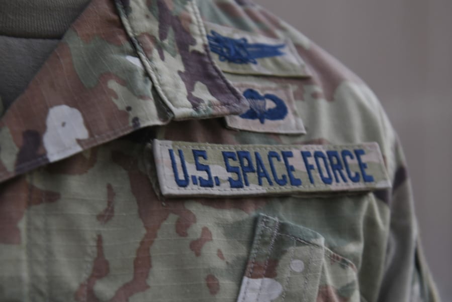 In this photo released by the U.S. Air Force, Capt. Ryan Vickers stands for a photo to display his new service tapes after taking his oath of office to transfer from the U.S. Air Force to the U.S. Space Force at Al-Udeid Air Base, Qatar, Tuesday, Sept. 1, 2020. Space Force, the first new U.S. military service since the creation of the Air Force in 1947, now has some 20 members stationed at Qatar&#039;s Al-Udeid Air Base in its first foreign deployment. (Staff Sgt. Kayla White/U.S.