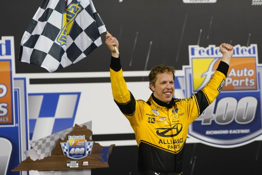 Brad Keselowski (2) celebrates in Victory Lane after winning a NASCAR Cup Series auto race Saturday, Sept. 12, 2020, in Richmond, Va.