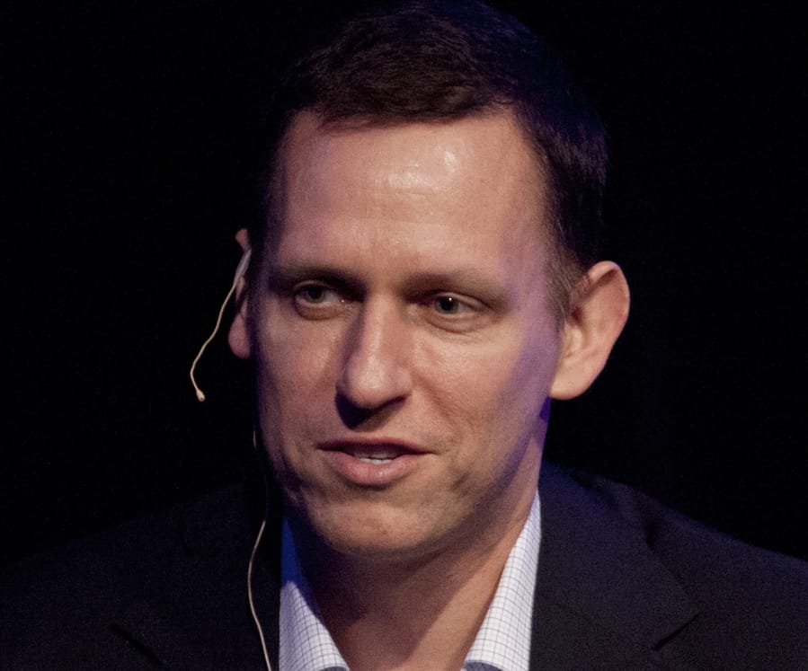 FILE - In this Thursday, March 8, 2012, file photo, Clarium Capital President Peter Thiel speaks during his keynote speech at the StartOut LGBT Entrepreneurship Awards in San Francisco. Seventeen years after it was born with the help of CIA seed money, Palantir Technologies is finally going public. Thiel, the iconoclastic entrepreneur and PayPal co-founder, holds the largest chunk of Palantir stock.