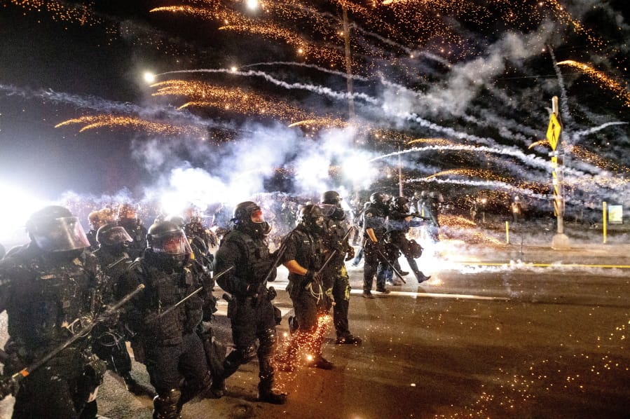 Police use chemical irritants and crowd control munitions to disperse protesters Sept. 5 in Portland.