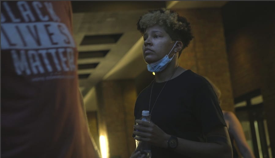 In this image taken from video, activist and rapper Genesis Be leaves her hotel on Thursday, Aug. 27, 2020, in Washington, before attending an event for Vote Common Good, a campaign aimed at Christian voters in swing states. Genesis Be helped ignite a nationwide conversation around the Confederate emblem as part of Mississippi&#039;s state flag until the flag was retired in June.