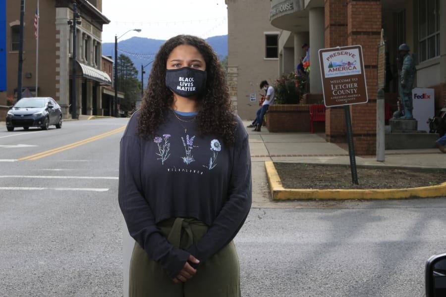 Dayja Hogg, 19, stands for a portrait in front of her home town&#039;s courthouse on Wednesday, Sept. 16, 2020, in Whitesburg, Ky. Following the deaths of George Floyd in Minneapolis and Breonna Taylor in Louisville, Hogg helped organize a protest in her home town of Whitesburg where she grew up experiencing racism.