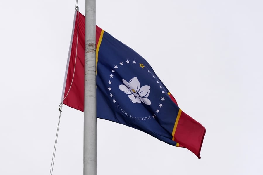 One of five final designs for the new Mississippi state flag flutters in the breeze, outside the Old Capitol Museum in Jackson, Miss., Aug. 25, 2020, in Jackson, Miss. In late June, Mississippi legislators voted to retire the last state flag to include the Confederate battle emblem, which is broadly condemned as racist. All five were flown outside the museum for viewing. The Mississippi State Flag Commission narrowed their choices to two flags, of which this is one. They will reconvene in September to make their final choice. (AP Photo/Rogelio V.