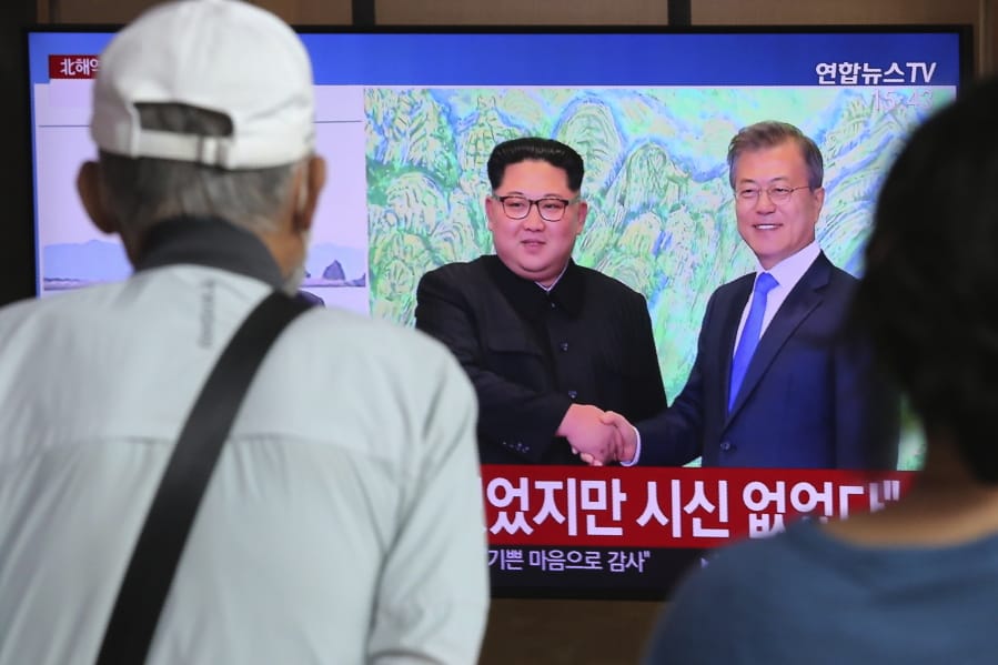 People watch a TV showing a file image of North Korean leader Kim Jong Un, left, and South Korean President Moon Jae-in during a news program at the Seoul Railway Station in Seoul, South Korea, Friday, Sept. 25, 2020. North Korean leader Kim apologized Friday over the killing of a South Korea official near the rivals&#039; disputed sea boundary, saying he&#039;s &quot;very sorry&quot; about the incident he called unexpected and unfortunate, South Korean officials said.