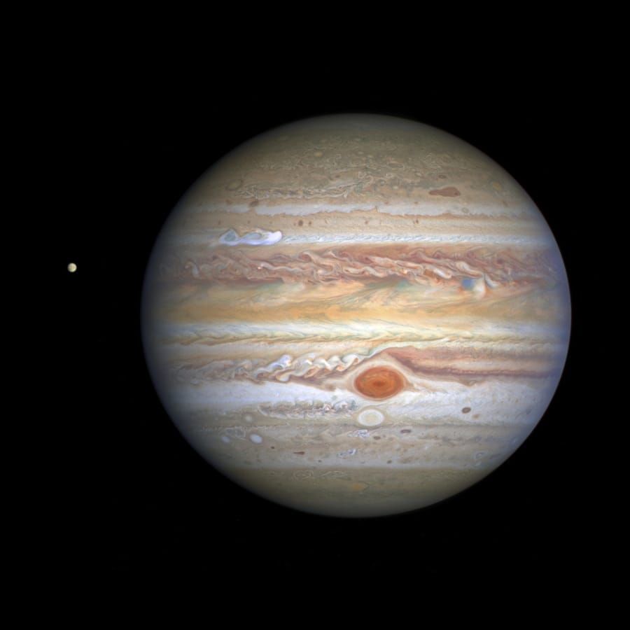 This Aug. 25 image captured by NASA&#039;s Hubble Space Telescope shows the planet Jupiter and one of its moons, Europa, at left, when the planet was 406 million miles from Earth. (NASA, ESA, STScI, A.