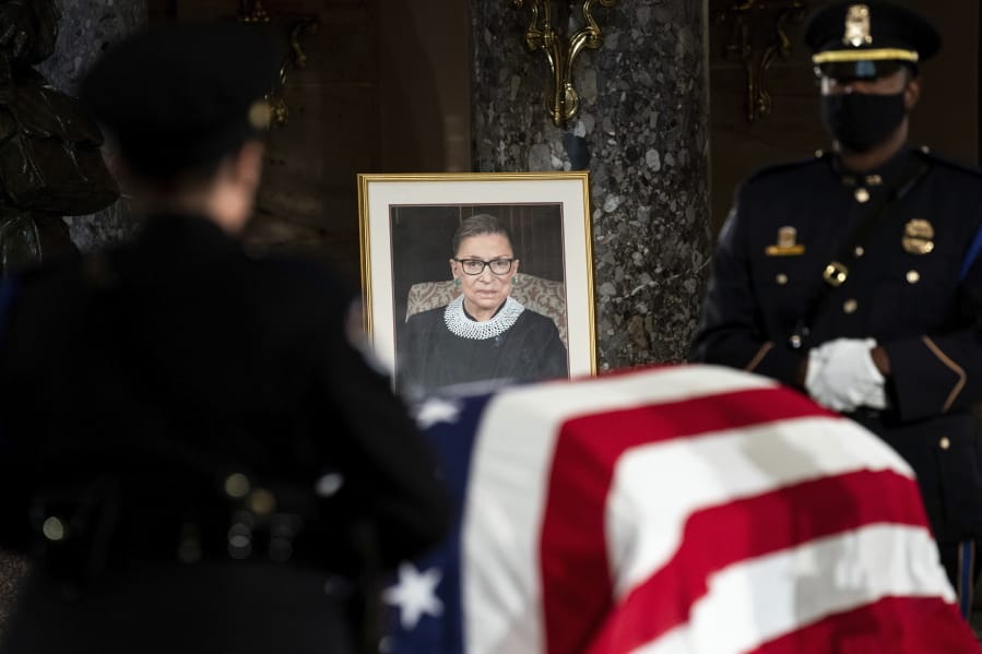 The flag-draped casket of Justice Ruth Bader Ginsburg lies in state in the U.S. Capitol on Friday, Sept. 25, 2020. Ginsburg died at the age of 87 on Sept. 18 and is the first women to lie in state at the Capitol.