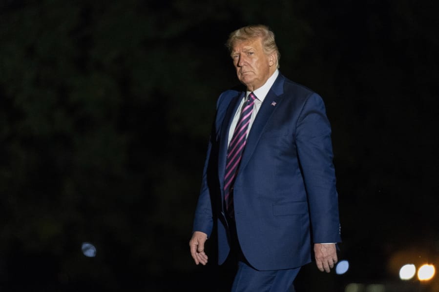 President Donald Trump walks on the South Lawn as he arrives at the White House, Monday, Sept. 14, 2020, in Washington from a trip to Phoenix.
