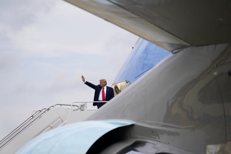 President Donald Trump waves as he boards Air Force One for a trip to Wilmington, N.C., Wednesday, Sept. 2, 2020, in Andrews Air Force Base, Md.