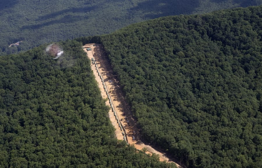 FILE - This July 18, 2018, file photo, shows the Mountain Valley Pipeline route on Brush Mountain in Virginia. The Trump administration is seeking to fast track environmental reviews of the pipeline and dozens of other energy, highway and other infrastructure projects across the U.S.
