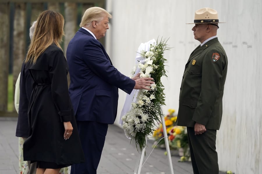 President Donald Trump lays a wreath at a 19th anniversary observance of the Sept. 11 terror attacks, at the Flight 93 National Memorial in Shanksville, Pa., Friday, Sept. 11, 2020.