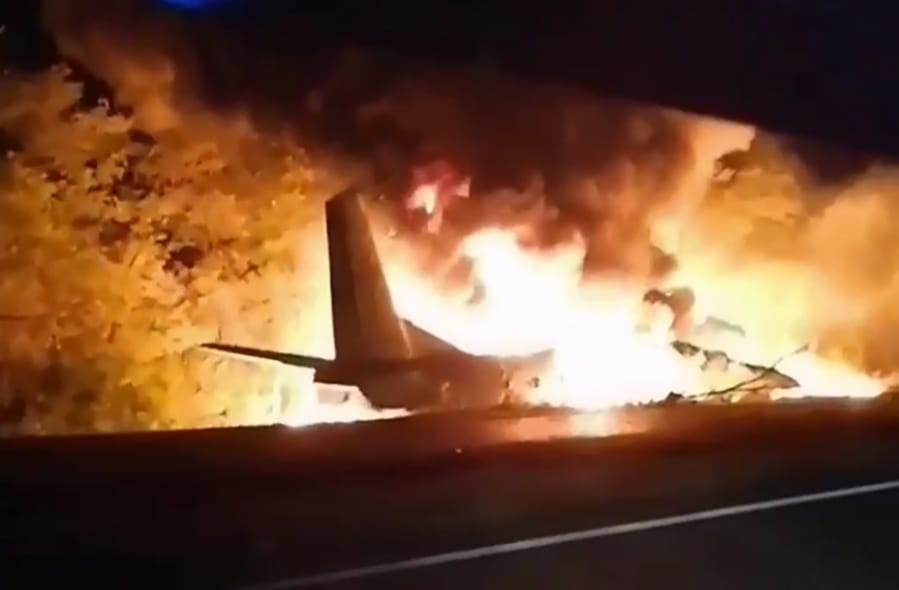 In this TV grab released by Ukraine&#039;s Emergency Situation Ministry, an AN-26 military plane bursts into flames Friday after it crashed in the town of Chuguyiv close to Kharkiv, Ukraine. At least 26 people were killed.
