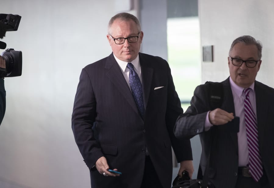 FILE - In this May 1, 2018, file photo, Former Donald Trump campaign official Michael Caputo, left, joined by his attorney Dennis C. Vacco, leaves after being interviewed by Senate Intelligence Committee staff investigating Russian meddling in the 2016 presidential election, on Capitol Hill in Washington. A House subcommittee examining President Donald Trump&#039;s response to the coronavirus pandemic is launching an investigation into reports that political appointees have meddled with routine government scientific data to better align with Trump&#039;s public statements. The Democrat-led subcommittee said Sept. 14, 2020 that it is requesting transcribed interviews with seven officials from the Centers for Disease Control and Prevention and the Department of Health and Human Services, including communications aide Michael Caputo. (AP Photo/J.