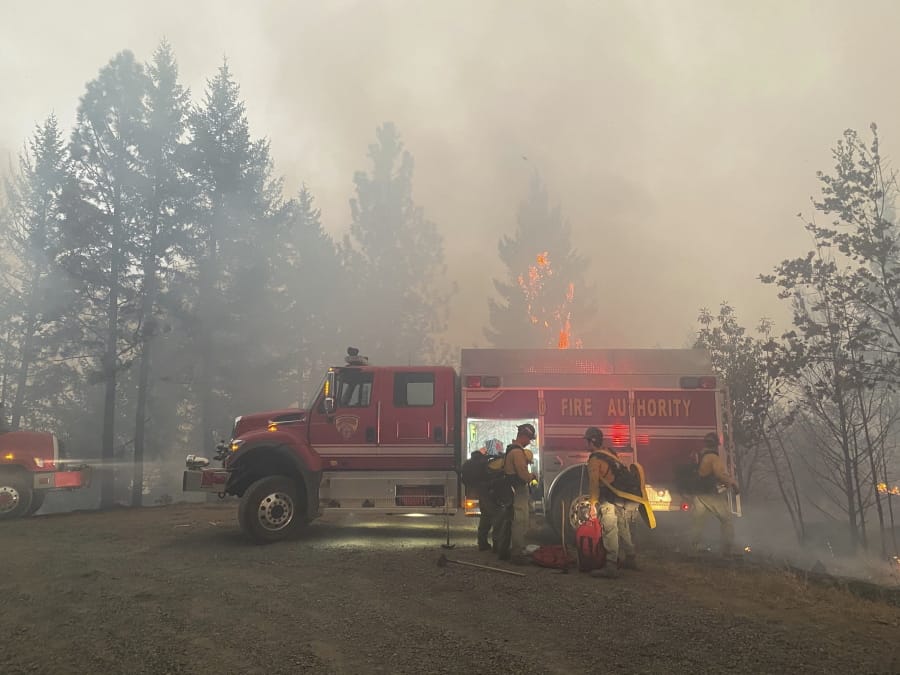 This photo provided by the Unified Fire Authority shows Utah fire crews prepare to fight wildfires near Butte Falls in southern Oregon on Saturday, Sept. 12, 2020.