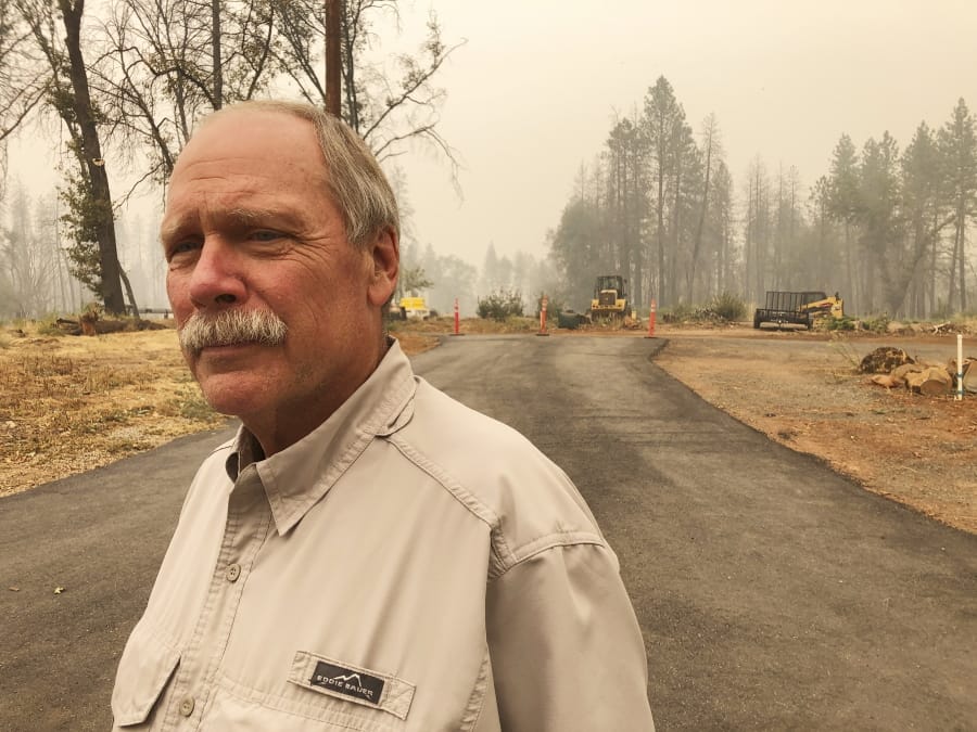 Paradise Town Councilman Steve Crowder stands on his property Thursday in Paradise, Calif., He lost his home in the 2018 wildfire, but he has since built a new house and moved back.