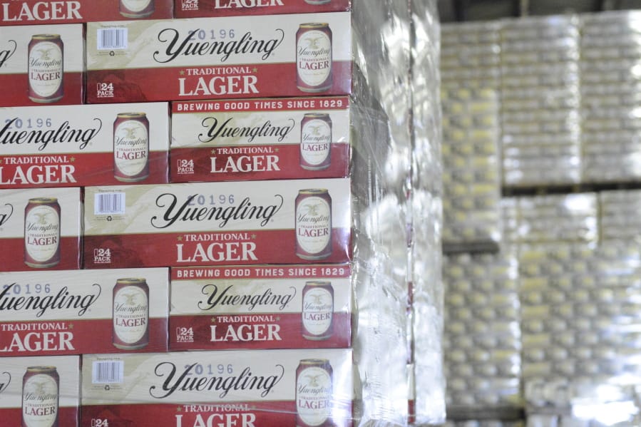 FILE - Cases of canned Yuengling Traditional Lager are stacked in the warehouse of the D.G. Yuengling &amp; Son Brewery Mill Creek plant on Tuesday, July 21, 2020, in Pottsville, Pa. Pottsville, Pennsylvania-based D.G. Yuengling and Son Inc. said Tuesday, Sept. it&#039;s forming a joint venture with Molson Coors Beverage Co. to expand distribution of its beers beyond the East Coast.