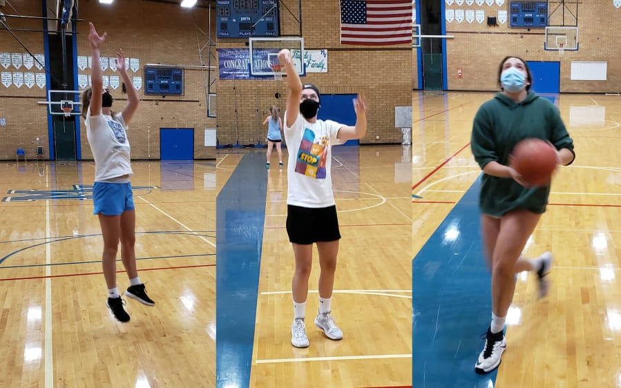 Mountain View girls basketball players Lauren DeLargy (left), Nina Peterson (center) and Ella Schoene (right) go through individual workouts this week in the Mountain View gym.