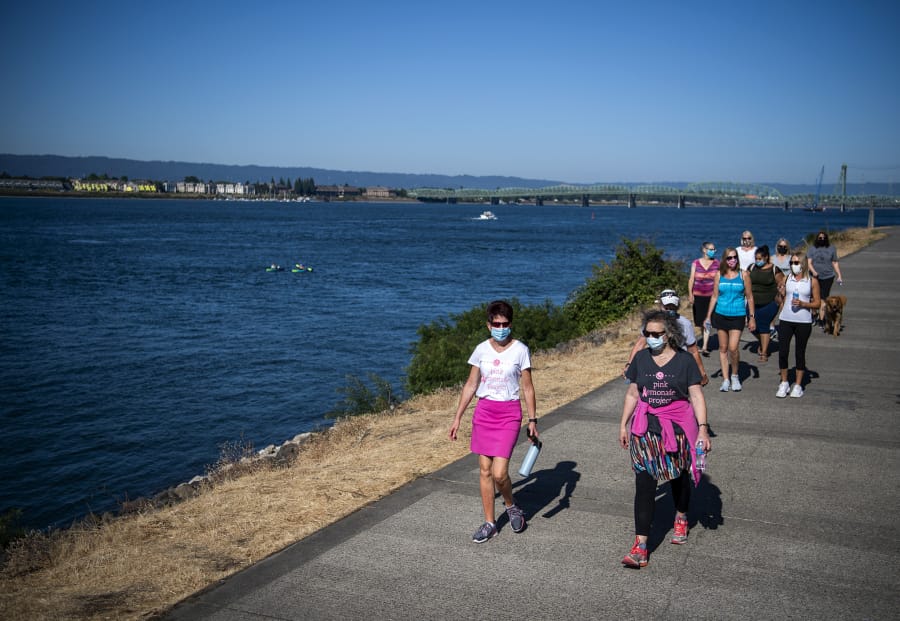 Pink Lemonade Project board member Susan Pagel, front left, and Pink Lemonade Project CEO Susan Stearns, front right, walk along the Vancouver&#039;s Columbia River Renaissance Trail with Pink Lemonade clients in August.