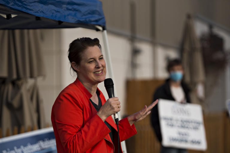 Congressional candidate Carolyn Long speaks to voters in Washougal during a drive-in town hall Monday evening, Oct. 12, 2020.