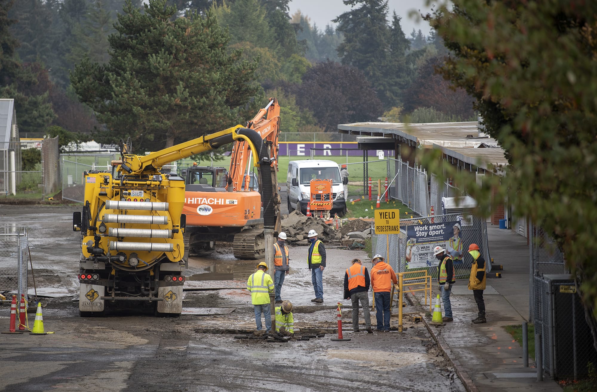 Contractors work a water main break at Columbia River High School in Vancouver on Oct. 16, 2020.