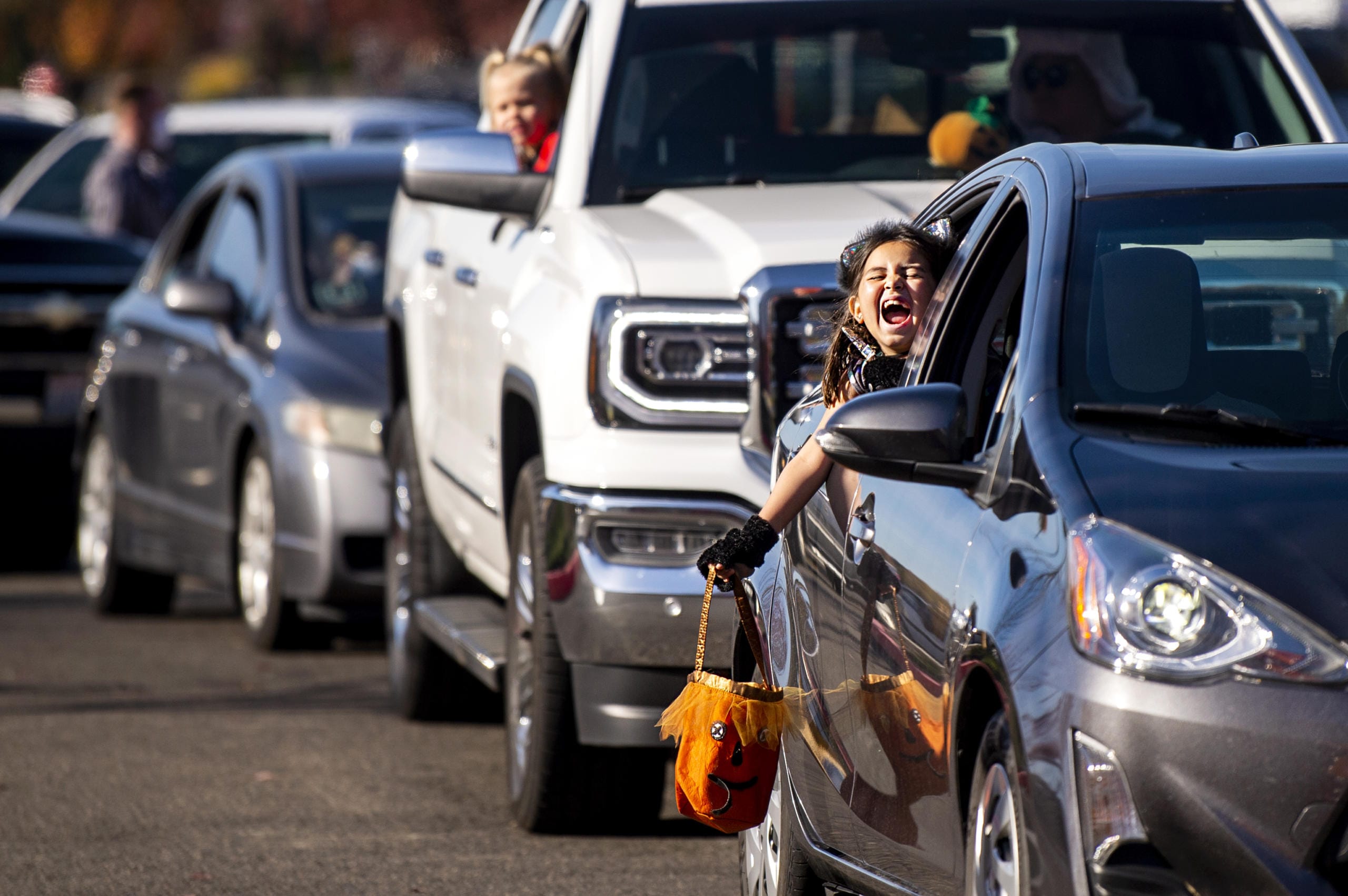 Abigail Pine, 7, screams in excitement as she sees costumed characters and goodie bags ahead of her during the fourth annual Booville, a drive-thru Halloween event put on by the Parks Foundation of Clark County at Vancouver Mall on Saturday. Abigail dressed as a kitten.