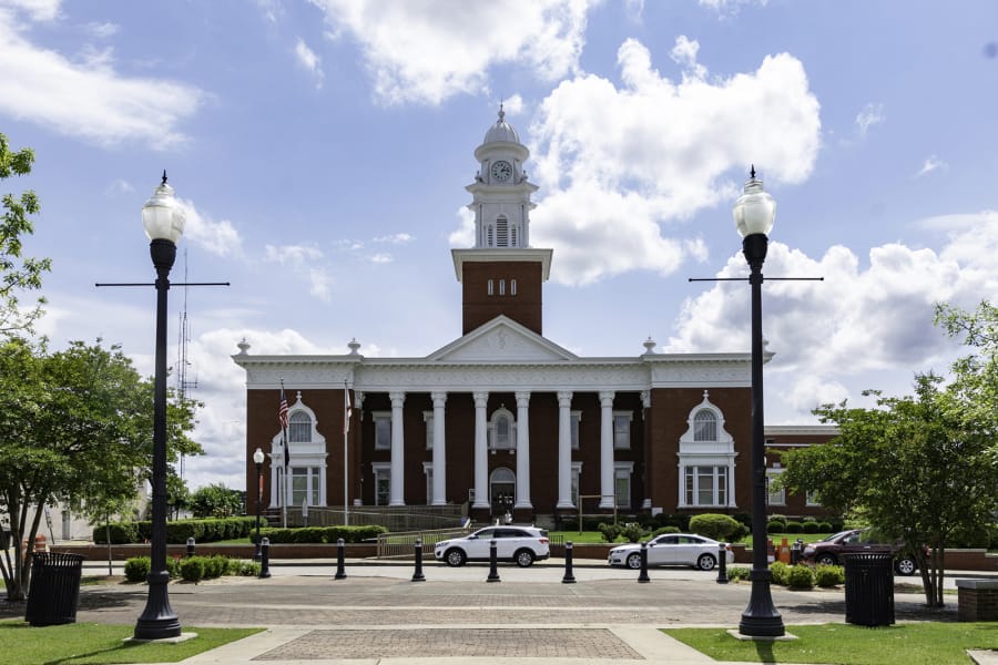 The exterior of Lee County Courthouse in Opelika, Alabama, where Barry Wilson and other relatives have been fighting a complicated legal battle for their share of family land. Tax and partition sales are among the legal actions that have precipitated the loss of Black-owned land in Mississippi and across the country.
