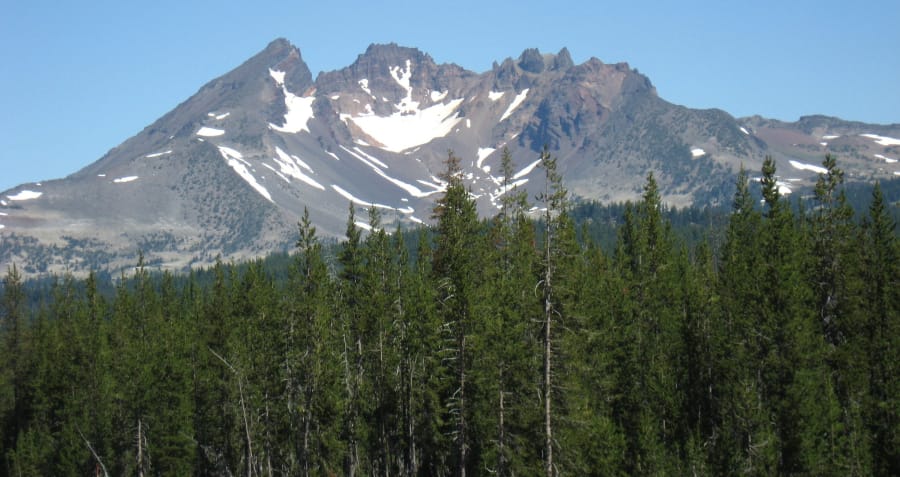 Ice age glaciers carved the features on Broken Top, a stratovolcano in the Central Oregon Cascades. Itis seen from the southeast on July 13, 2007, from the Cascade Lakes Highway just north of Mount Bachelor.