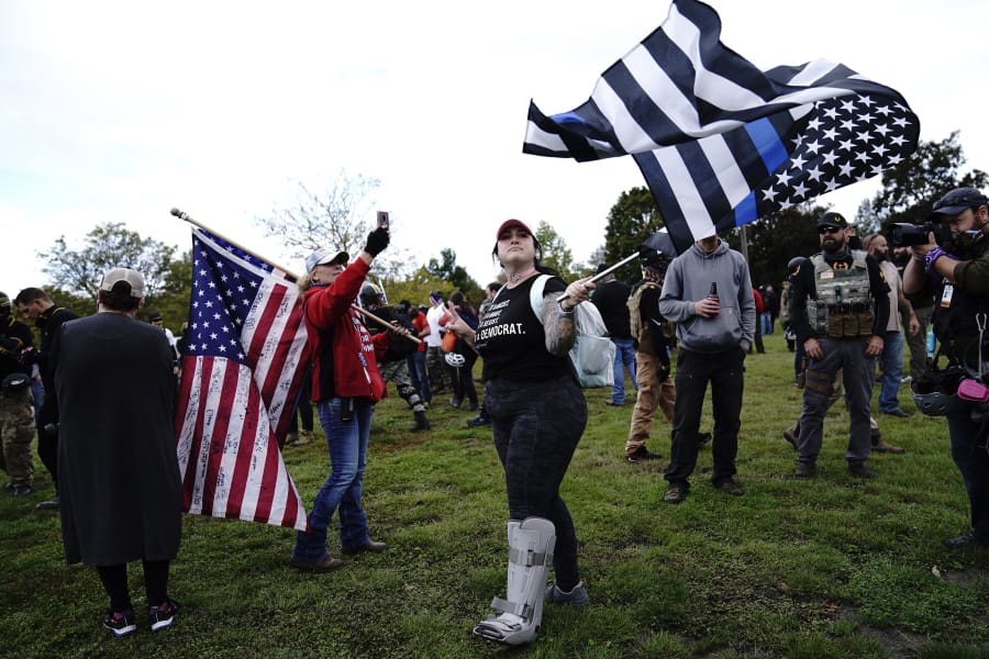 Members of the Proud Boys and other right-wing demonstrators rally on Saturday, Sept. 26, 2020, in Portland, Ore.